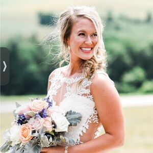 Charming White Wedding Dress with Delicate Lace and Flowing Skirt